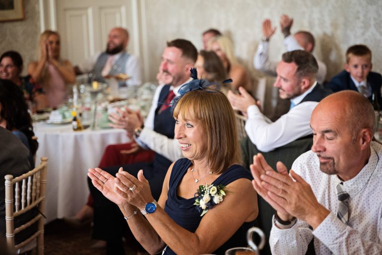 wedding guests clap at the end of the speeches.